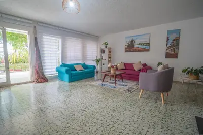 a living room with two couches and a table at Casa Caribe, excellent location in Bocagrande in Cartagena de Indias