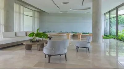a living room with a couch and a table and chairs at Hermoso y acogedor Monoambiente in Cartagena de Indias
