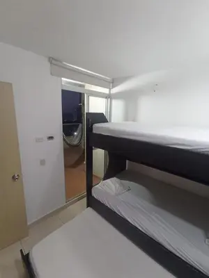 a room with two bunk beds and a mirror at aqualina911 in Cartagena de Indias
