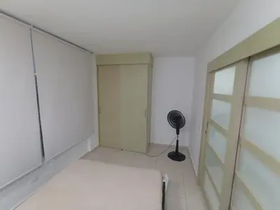 a white room with a closet and a fan at aqualina911 in Cartagena de Indias