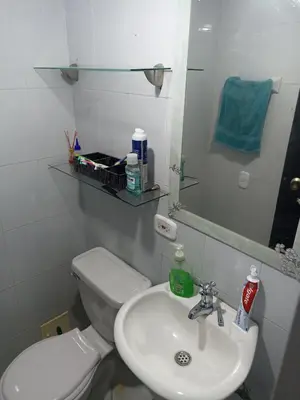 a bathroom with a white toilet and a sink at Confortable y comodo apartamento in Cartagena de Indias