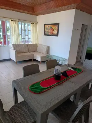 a living room with a table with a hat on it at Las Margaritas Frente al Mar 2 in Coveñas