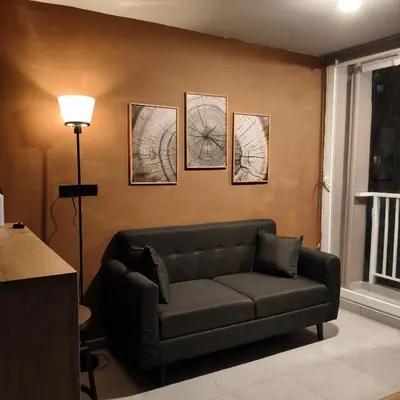 a living room with a couch and pictures on the wall at Exclusive apartament near downtown and beach in Cartagena de Indias