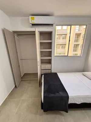 a small bedroom with a bed and a window at Cartagena, Serena del Mar, Capriella in Manzanillo del Mar