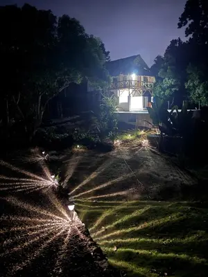 a house at night with lights in front of it at City Escape Casa Mariguana in Turbaco