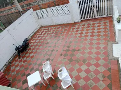 an aerial view of two white chairs and a scooter at Habitación con aire y piscina in Santa Veronica