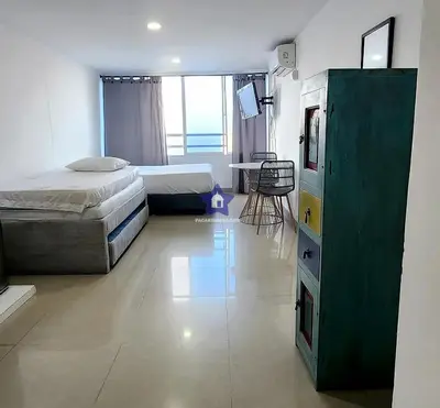 a bedroom with a bed and a desk in it at Estudio Sky View - Piso 20 in Cartagena de Indias