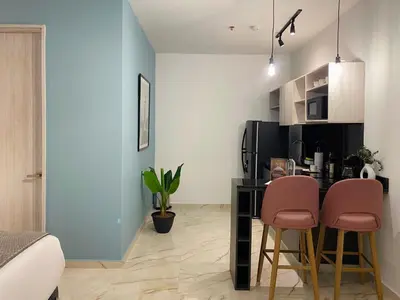 a kitchen with a table and two chairs in a room at Muralla by Wynwood House in Cartagena de Indias