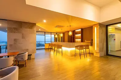 an open kitchen and dining room with a table and chairs at Vista al Mar/ Centro Histórico/ Nuevo Piso 26 1BR in Cartagena de Indias