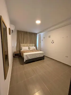 a bedroom with a large bed in a room at Davé Paradise in Cartagena de Indias