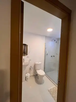 a bathroom with a toilet and a shower at Davé Paradise in Cartagena de Indias