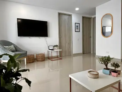 a living room with a flat screen tv on the wall at Escapada 2BR en Ocean Drive in Cartagena de Indias