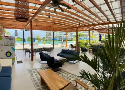 a pavilion with chairs and tables and a patio at baia kristal paraiso aguas cristalinas in Cartagena de Indias