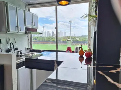 a kitchen with a large window looking out at the city at Studio Apartment Old City Cartagena Almirante in Cartagena de Indias