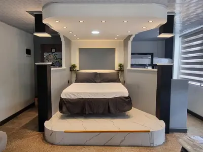 a bedroom with a bed in the middle of it at Studio Apartment Old City Cartagena Almirante in Cartagena de Indias