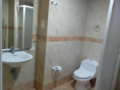 a bathroom with a toilet and a sink at Toscana Suite 3009 in Las Margaritas