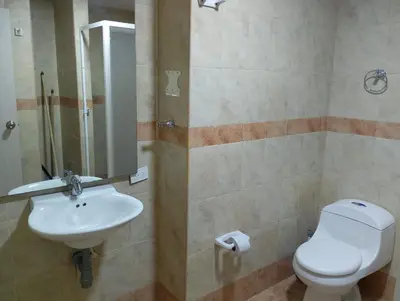a bathroom with a toilet and a sink at Toscana Suite 3009 in Las Margaritas