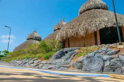 a group of huts with thatched roofs at Parque Caribe Aventura in El Cerrito