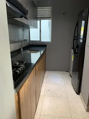 a kitchen with a sink and a stove in it at Apartamento acogedor in Barranquilla