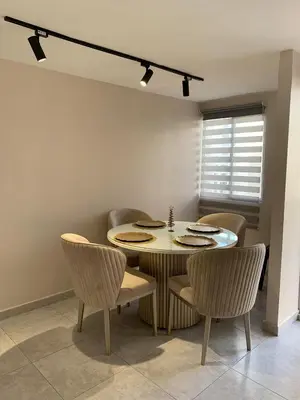 a dining room with a table and chairs at Apartamento acogedor in Barranquilla