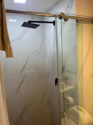 a shower with a glass door in a bathroom at Sunset 47 mar y vida in Cartagena de Indias