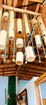 a group of baskets hanging from the ceiling of a room at Cabaña Alojamiento Valhalla in Rincón