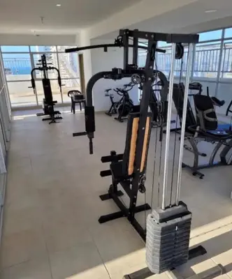 a gym with treadmills and exercise equipment in a building at Encanto cerca al mar in Cartagena de Indias