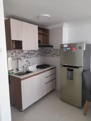 a kitchen with a stainless steel refrigerator and a sink at Apartamento Amoblado in Cartagena de Indias