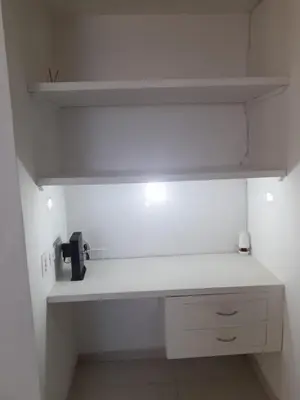 a kitchen with a white counter top and a shelf at Apartamento Amoblado in Cartagena de Indias