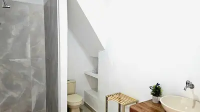 a bathroom with a sink and a toilet at Apartamento cerca a la playa y al mar Punta Roca in Maizal