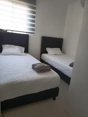a bedroom with two beds and a window at B lounge experience ctg bolívar in Cartagena de Indias