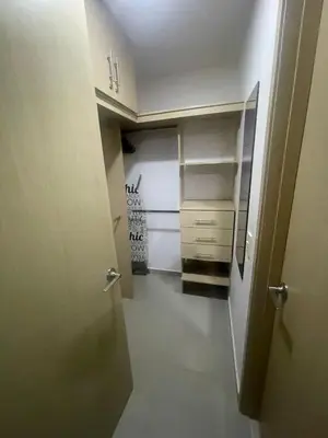 a hallway leading to a room with a closet at Apartaestudio 91 in Barranquilla
