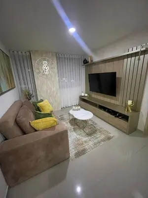 a living room with a couch and a flat screen tv at Apartaestudio 91 in Barranquilla