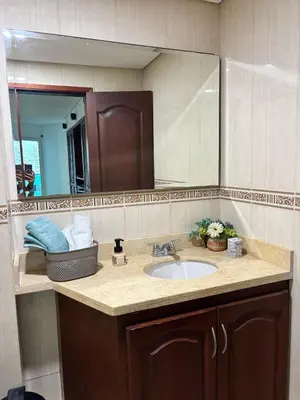 a bathroom with a sink and a mirror at Ocean and Lagoon View Apartment in Cartagena El Laguito 804A in Cartagena de Indias