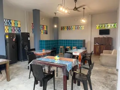 a restaurant with tables and chairs in a room at Terraza Del Sol in Coveñitas