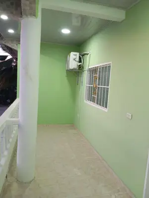 an empty room with a cage in the wall at Apartamentos el farol in Ciénaga