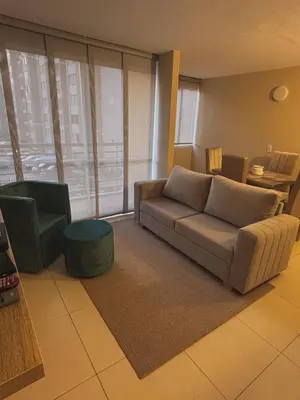 a living room with a couch and a table at Apartment in Alameda del Río in Barranquilla