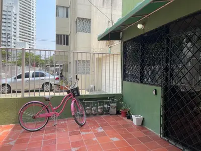 a pink bike is parked on a balcony at Homethel Studio Apt privado in Cartagena de Indias