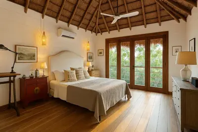 a bedroom with a bed and a ceiling fan at Hacienda San Benito in Cartagena de Indias