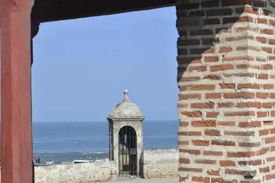 a view of the ocean from a brick wall at Apartment with a Pool and Parking 2Bed in Cartagen in Cartagena de Indias