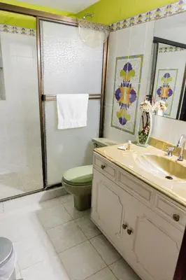 a bathroom with a toilet and a sink and a shower at Casa Gaitán Beach and comfort by the sea in Cartagena de Indias