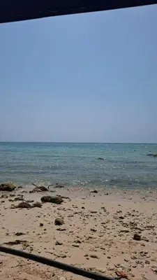 a sandy beach with the ocean in the background at Exclusive Loft in Barú, access by sea and land in Isla Barú