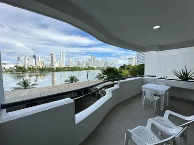 a balcony with a view of a river and buildings at Apartamento Moderno con Piscina en el Laguito in Cartagena de Indias