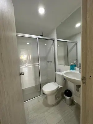 a bathroom with a shower and a toilet and a sink at Apartamento Moderno con Piscina en el Laguito in Cartagena de Indias