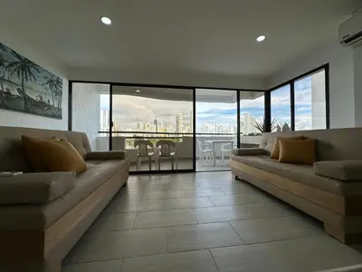 a living room with couches and a view of the city at Apartamento Moderno con Piscina en el Laguito in Cartagena de Indias
