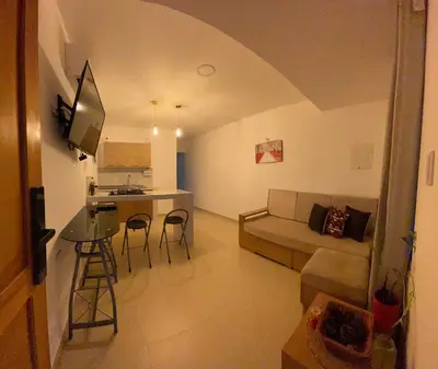 a living room with a couch and a table at Holtalia in Santiago