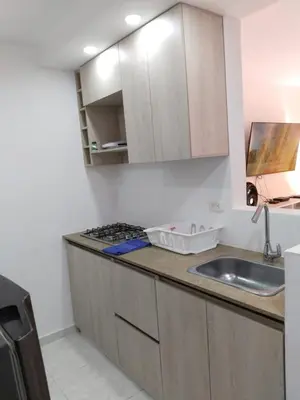 a kitchen with a sink and a counter top at EntreLagos Family Suite Vista a la Ciudad in Cartagena de Indias