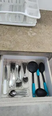 a drawer filled with utensils in a drawer at EntreLagos Family Suite Vista a la Ciudad in Cartagena de Indias