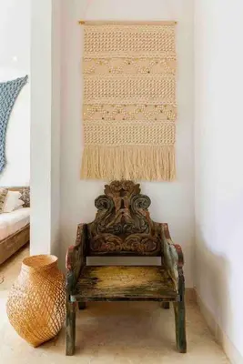 a chair sitting in a room with a wall at Charming Cartagena Apartment Your Perfect Getaway in Cartagena de Indias