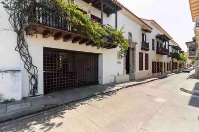 a building with a gate on the side of a street at Charming Cartagena Apartment Your Perfect Getaway in Cartagena de Indias